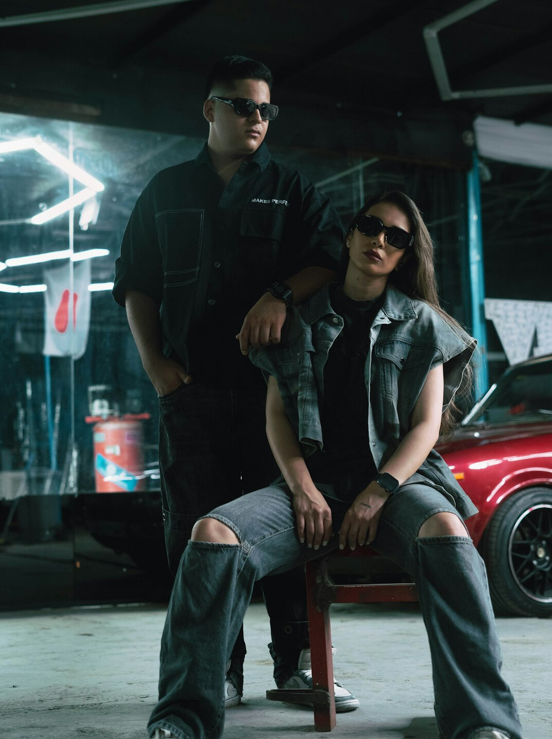 Mechanic and customer discussing car in a garage