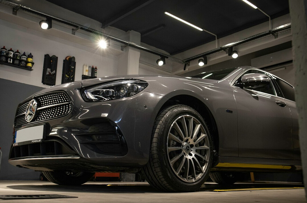 Clean glossy car exterior after detailing in a garage